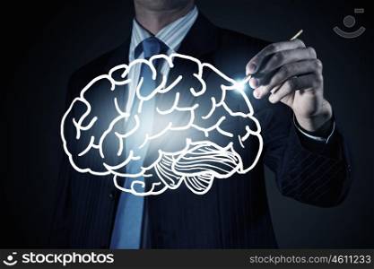 Businessman drawing brain. Chest view of businessman drawing mind concept on screen