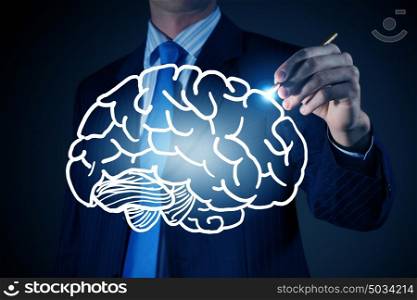 Businessman drawing brain. Chest view of businessman drawing mind concept on screen