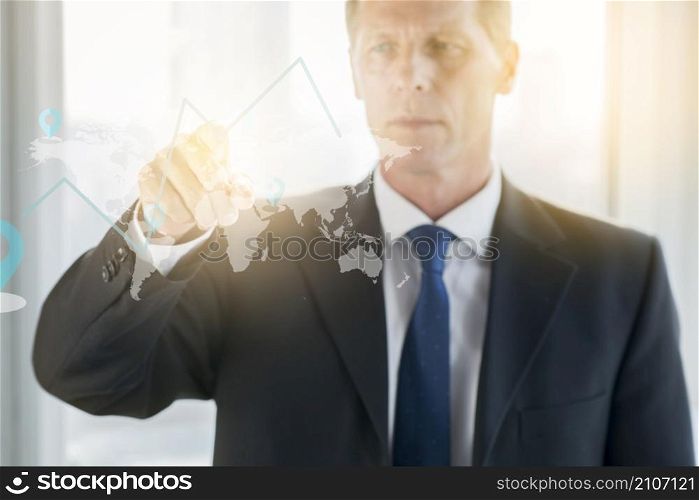 businessman drawing graph transparent glass board