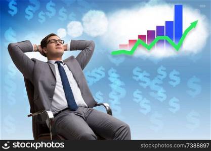 Businessman dreaming of stock market recovery