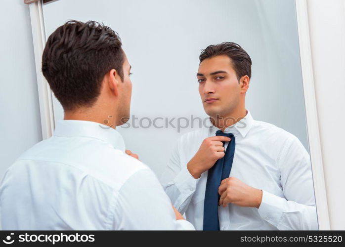 Businessman dressing up for work