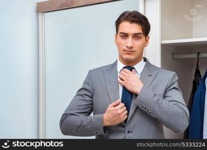 Businessman dressing up for work
