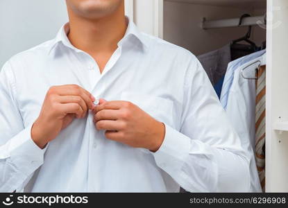 Businessman dressing up for work