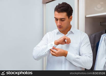 Businessman dressing up for work