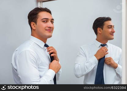 Businessman dressing up for work