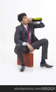 Businessman drinking alcohol