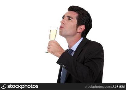Businessman, drinking champagne, alone