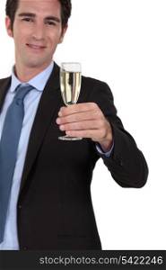 Businessman drinking champagne alone