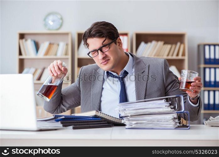 Businessman drinking in the office
