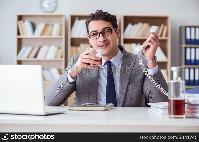 Businessman drinking in the office