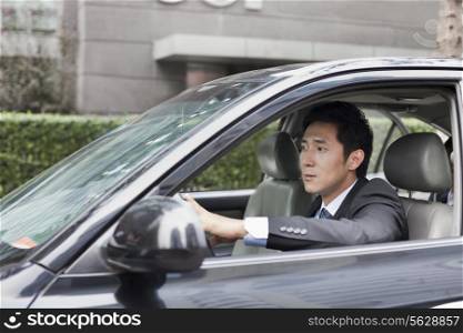 Businessman Driving Car