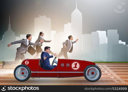 Businessman driving car in competition concept