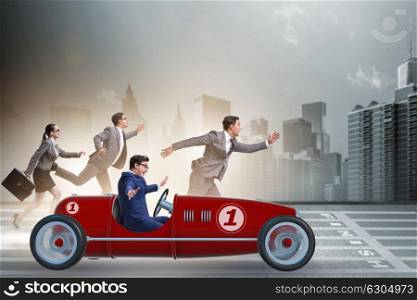 Businessman driving car in competition concept