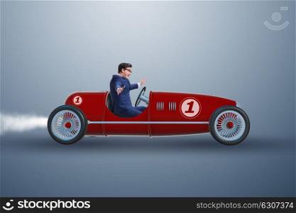 Businessman driving car in competition concept