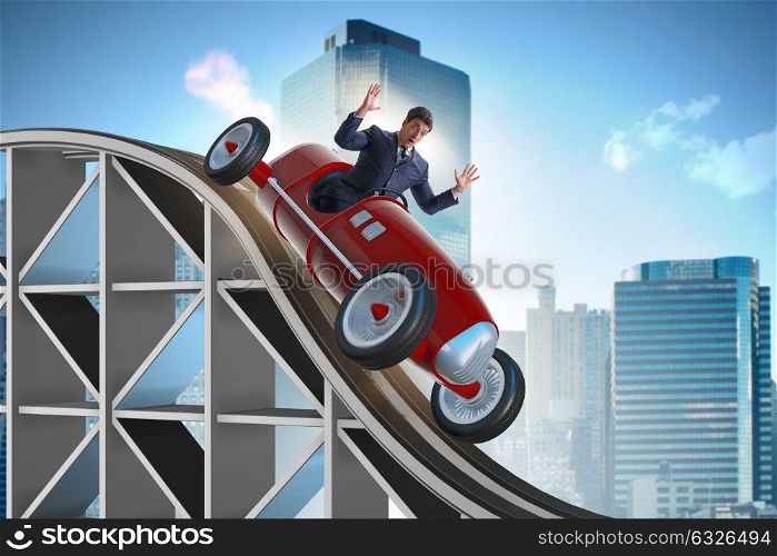 Businessman driving sports car on roller coaster