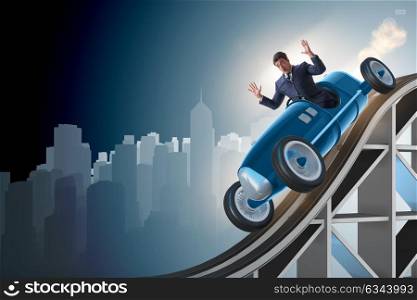 Businessman driving sports car on roller coaster