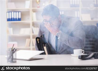 Businessman during fire alarm in office