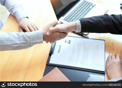 businessman employee candidate shaking hands with company leader HR manager or boss in office after successful negotiation, recruitment career and placement interview concept