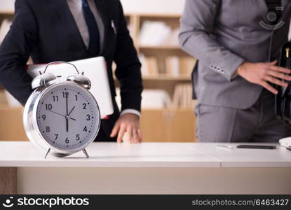 Businessman employee in urgency and deadline concept with alarm . Businessman employee in urgency and deadline concept with alarm clock