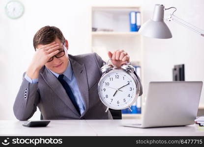 Businessman employee in urgency and deadline concept with alarm . Businessman employee in urgency and deadline concept with alarm clock. Businessman employee in urgency and deadline concept with alarm