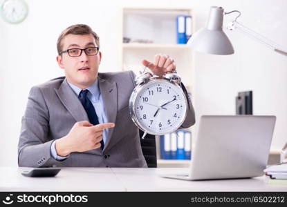 Businessman employee in urgency and deadline concept with alarm . Businessman employee in urgency and deadline concept with alarm clock. Businessman employee in urgency and deadline concept with alarm