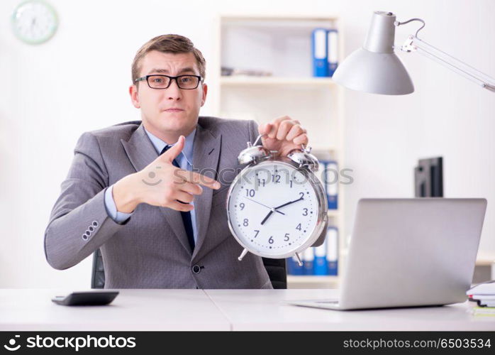 Businessman employee in urgency and deadline concept with alarm . Businessman employee in urgency and deadline concept with alarm clock. Businessman employee in urgency and deadline concept with alarm