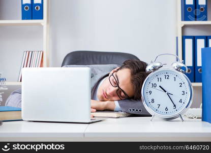 Businessman employee in urgency and deadline concept with alarm clock