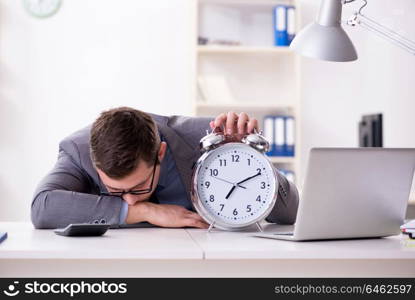 Businessman employee in urgency and deadline concept with alarm clock. Businessman employee in urgency and deadline concept with alarm