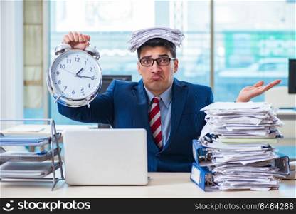 Businessman employee in urgency and deadline concept with alarm clock. Businessman employee in urgency and deadline concept with alarm