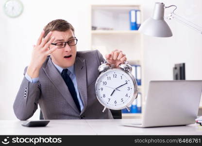 Businessman employee in urgency and deadline concept with alarm clock. Businessman employee in urgency and deadline concept with alarm