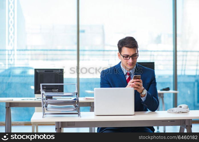 Businessman employee talking on the office phone