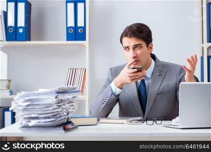 Businessman employee talking on the office phone