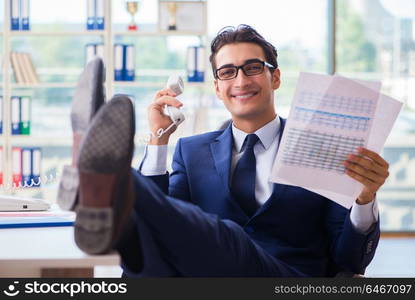 Businessman employee talking on the office phone