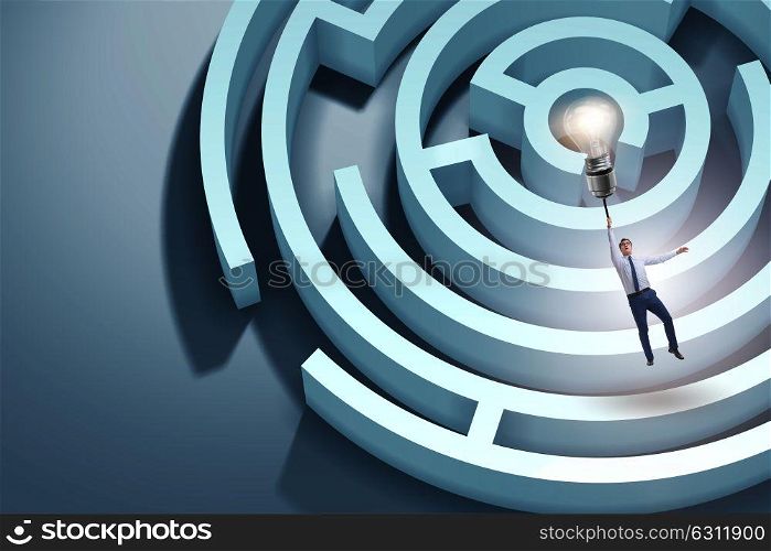 Businessman escaping from maze on balloon. The businessman escaping from maze on balloon