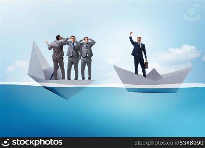 Businessman escaping sunken paper boat ship