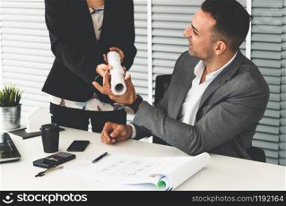 Businessman executive checking work while meeting discussion with businesswoman worker in modern workplace office. People corporate business team concept.