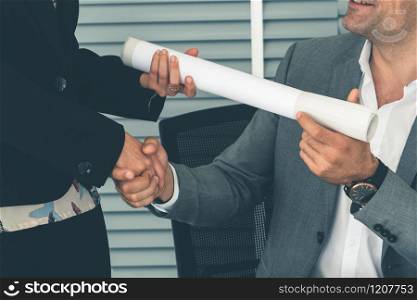 Businessman executive handshake with businesswoman worker in modern workplace office. People corporate business deals concept.. Businessman handshake businesswoman in office.