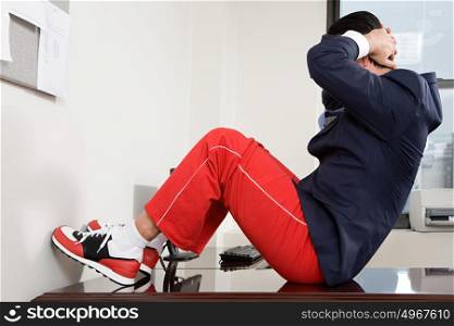 Businessman exercising in office