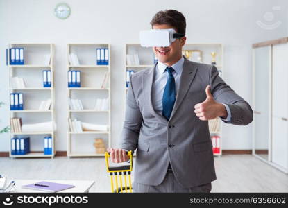 Businessman exercising with elastic expander wearing VR glasses