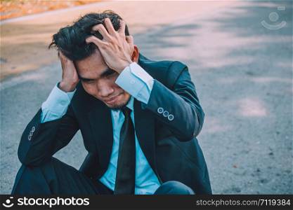 Businessman fail work and Business,Business people sit stressful and headache