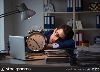 Businessman falling asleep during long hours in office