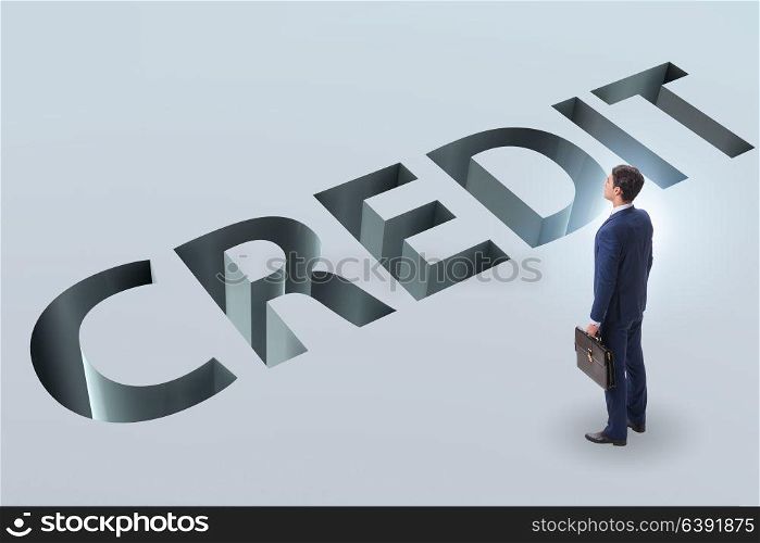Businessman falling into trap of borrowing debt and credit