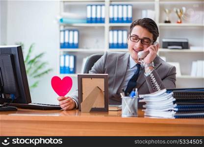 Businessman feeling love and loved in the office