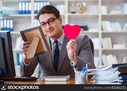 Businessman feeling love and loved in the office