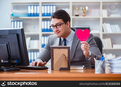 Businessman feeling love and loved in the office