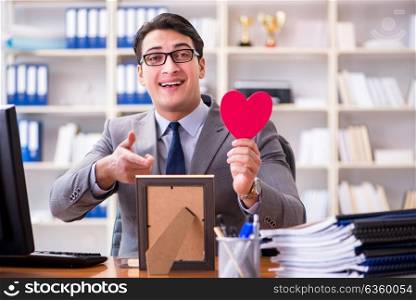 Businessman feeling love and loved in the office