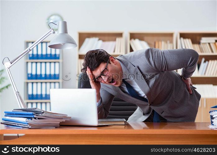 Businessman feeling pain in the office