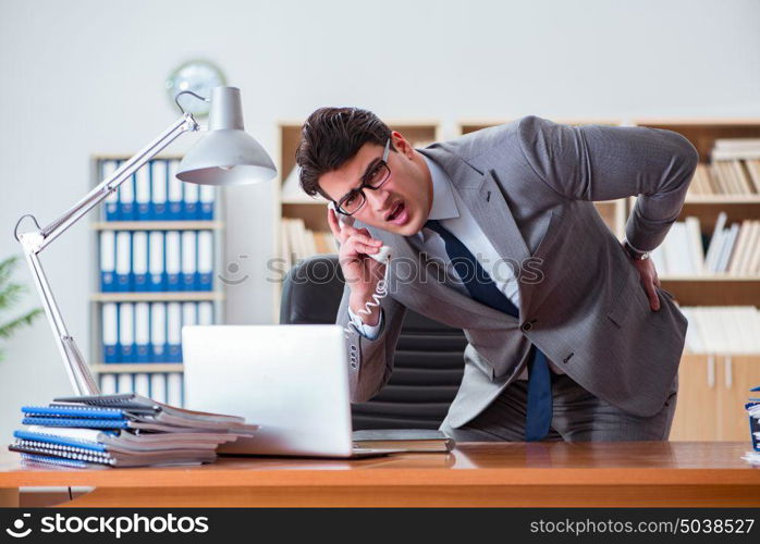 Businessman feeling pain in the office