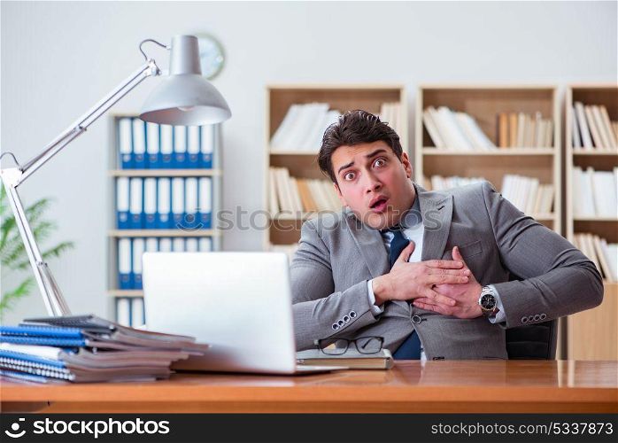 Businessman feeling pain in the office