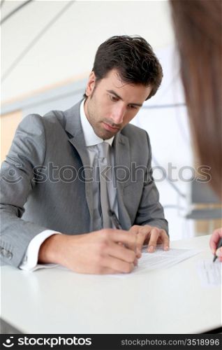 Businessman filling in business contract